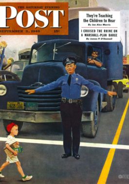 Policeman stopping traffic for schoolboy