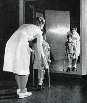 A 4-year-old polio victim is taught how to walk properly with braces in 1949. (Photo by Gus Pasquarella, ©SEPS)