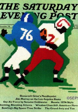 Two football players in mid-tackle, done in needlepoint.