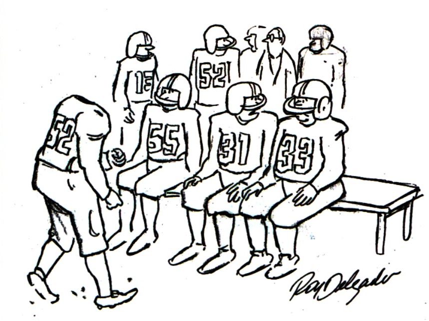Football players discuss a play amongst themselves while their headless teammate walks towards them.