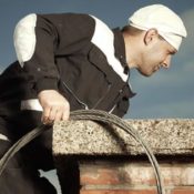 A chimney sweeper at work