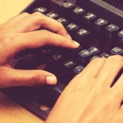 Hands on a typewriter