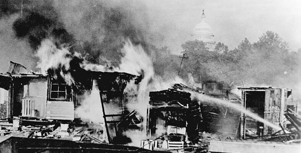 A Bonus Army encampment in Ancosta Fields is aflame after a confrontation with the U.S. military