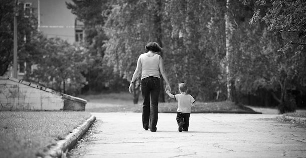 Grandmother walking with her grandson