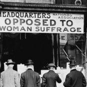 People standing in front of a anti-suffrage headquarters