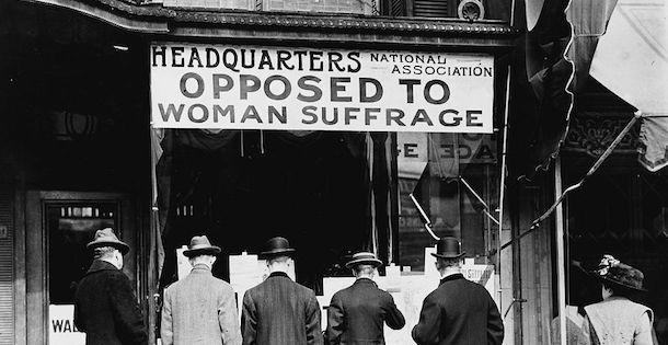 People standing in front of a anti-suffrage headquarters