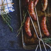 Sausage in tongs