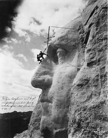 Gutzo Borglum working on George Washington's face on Mt. Rushmore