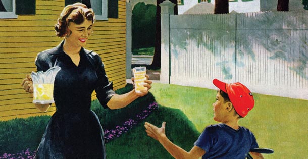 A mother handing her son a glass of lemonade