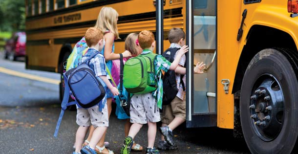 Kids boarding a school bus