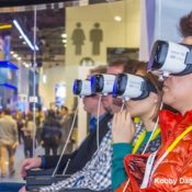 People sitting in chairs with VR headsets