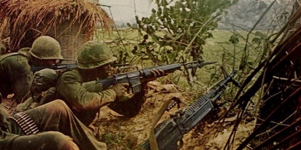 Soldiers fighting in Vietnam jungle