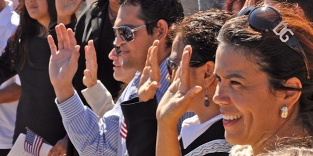 Immigrants taking the oath of citizenship