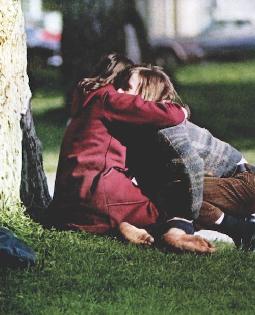 Hippies hugging in the park