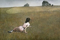 Woman on grass looking at horizon