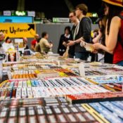 Comic convention attendees browsing Japanese manga