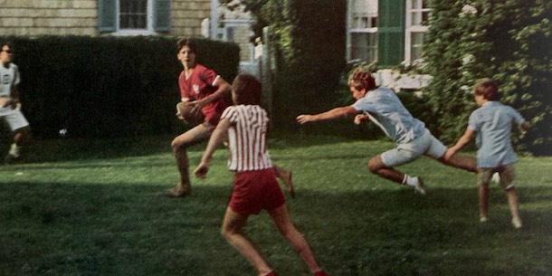 Robert Kennedy attempting a sack on a quarterback in a game of touch football.