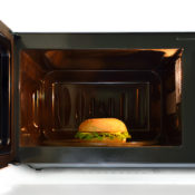 Microwave oven with a chicken sandwich inside