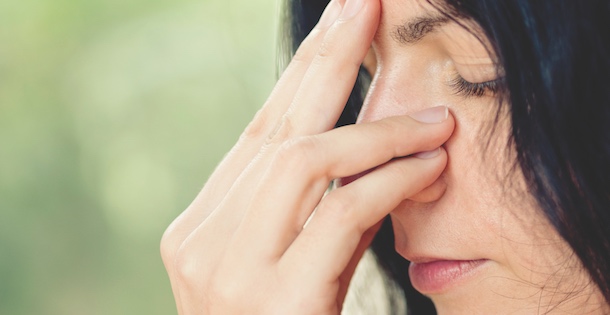 Woman taking a calming breath