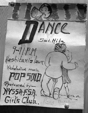A sign advertising a community dance