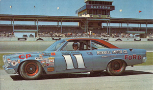 Mario Andretti in a blue Ford Fairlane