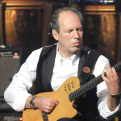 Hans Zimmer playing a guitar