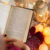 Reading next to a Christmas tree