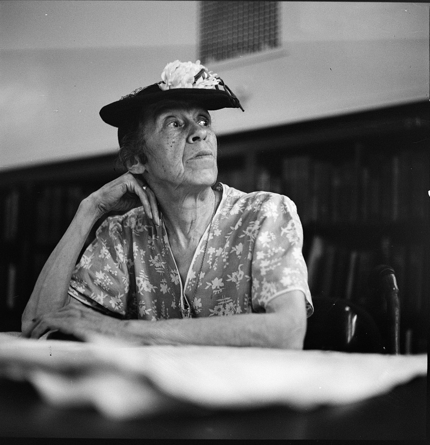 A woman in the reading room of a public library,