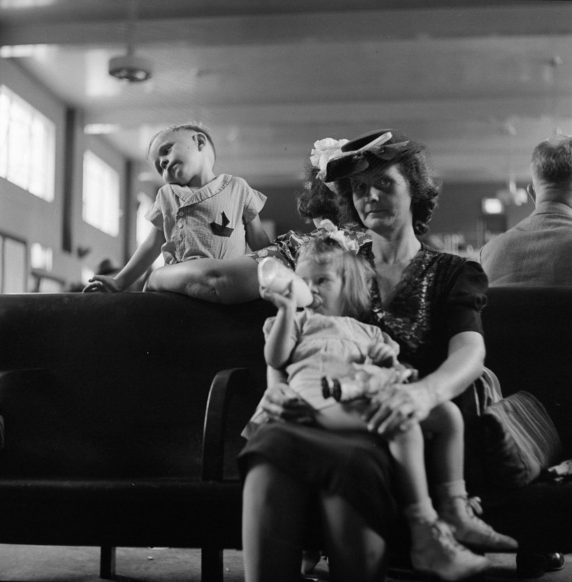 Passengers in the waiting room of the Greyhound bus station,