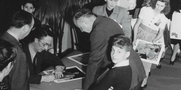 Norman Rockwell signing autographs