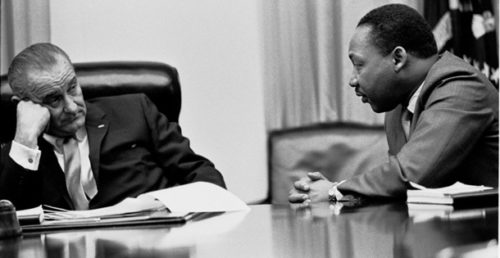 President Johnson listening to Dr. Martin Luther King, Jr. in the White House