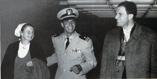 Lt. Dengler, in uniform, smiles with his parents.