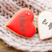 Valentine buttons with the words "I Love You" and "Be Mine" written on them.