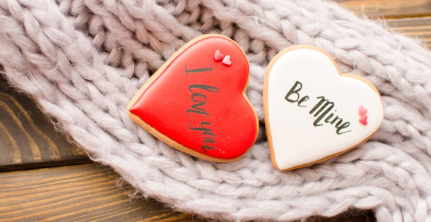 Valentine buttons with the words "I Love You" and "Be Mine" written on them.