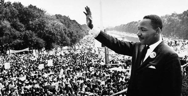 Dr. Martin Luther King Jr. waves to the crowd during the March on Washington