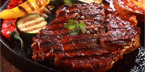 A cooked steak on a plate