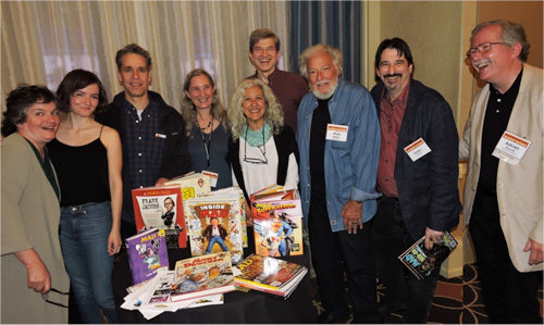 Cartoonists pose for a group photo.