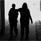 A social worker comforts a mental health patient