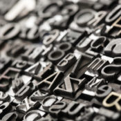 Metal typeface arranged together in a collage.