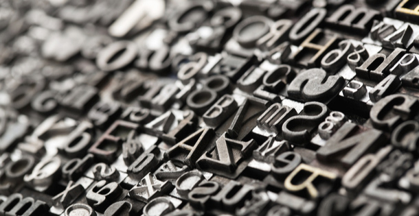 Metal typeface arranged together in a collage.