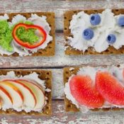 Graham wafers with slices of fruit and vegetables.