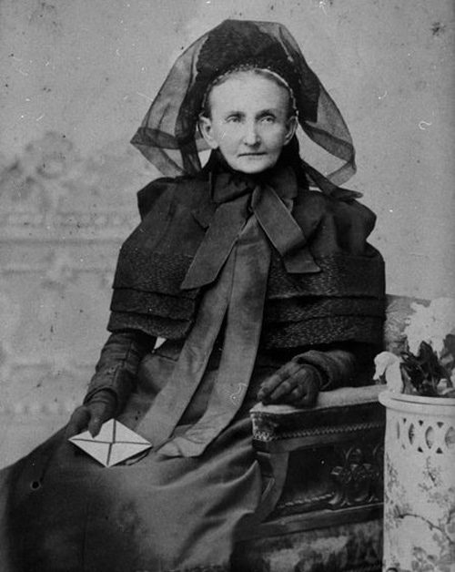 A woman dressed in black mourning clothes.