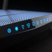 Router with all its lights on, indicating a working connection to the internet.