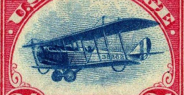 Illustration of a biplane carrying mail on a U.S. postage stamp.