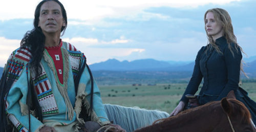 Actors Jessica Hastain and Michael Greyeyes on horseback.