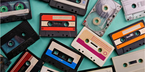 A collection of cassette tapes on a table.