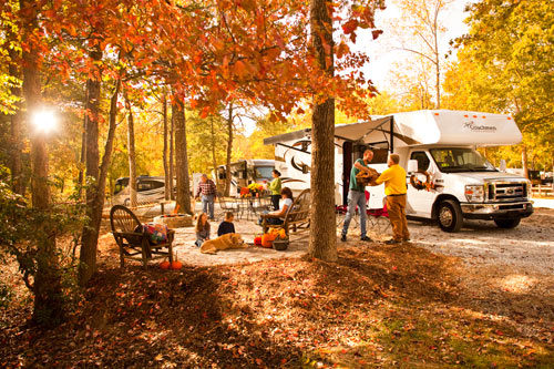 Campers meet in a wooded area to barter their employment.