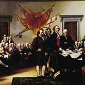 Scene of delegates signing the Declaration of Independence.