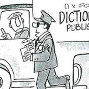 Policeman walks up to a truck delivering dictionaries.