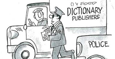 Policeman walks up to a truck delivering dictionaries.